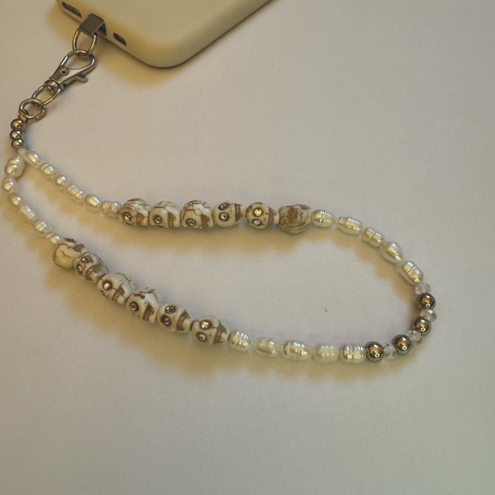 Cell phone wristlet from The Charm Hut works on any phone case